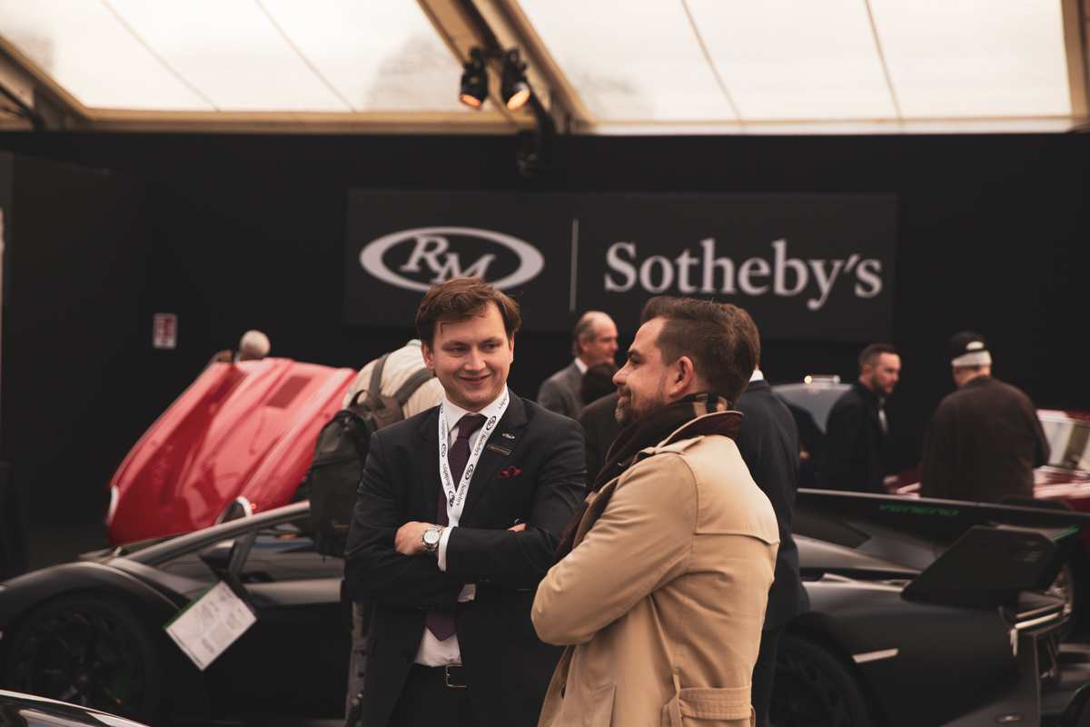 RM Sotheby’s Car Specialist Stephan Knobloch discussing cars with a potential client at Paris 2020