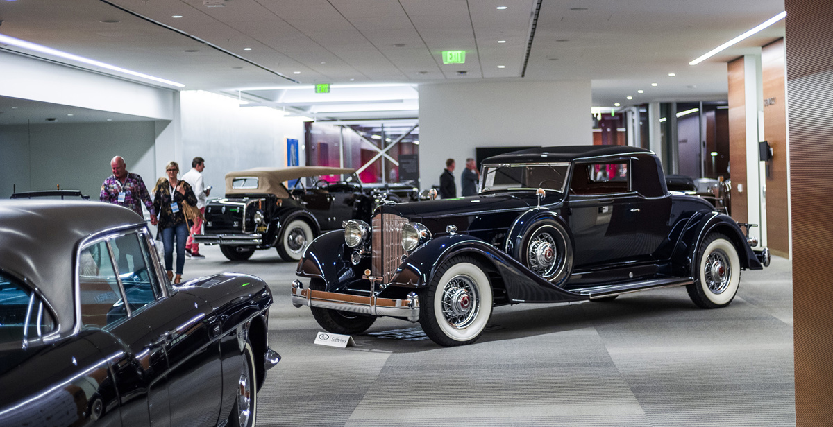 Spectators viewing lots on display at RM Sotheby's Live Monterey Auction Preview 2021