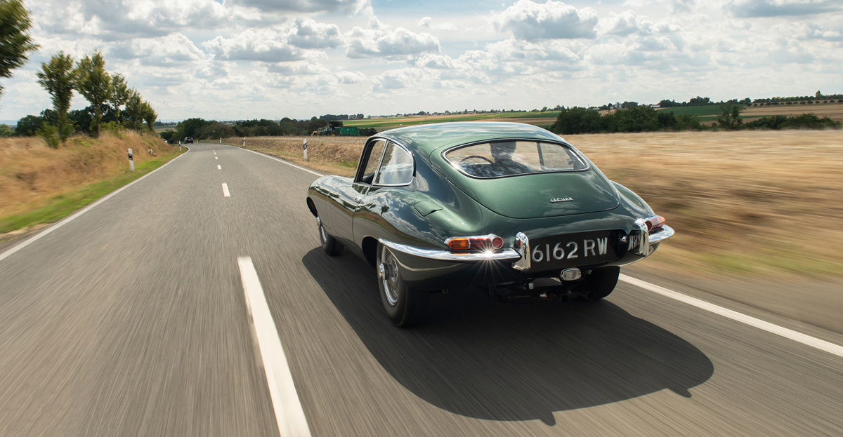 Driving shot of 1961 Jaguar E-Type Series 1 3.8-Litre Fixed Head Coupé offered at RM Sotheby's London online auction 2020